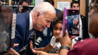 Really creepy: Joe Biden appears to sniff a child during a surprise visit